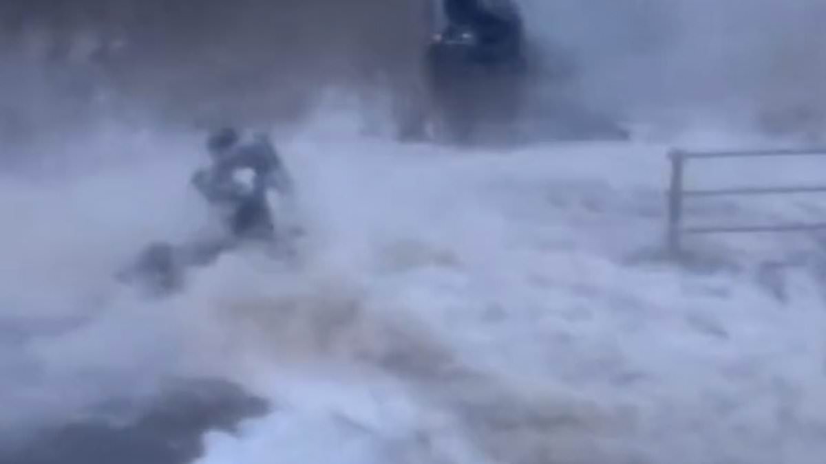 alert-–-moment-woman-is-knocked-off-her-mobility-scooter-by-giant-wave-as-britain-is-battered-by-more-heavy-rain…-before-storm-ciaran-brings-gale-force-winds-and-downpours