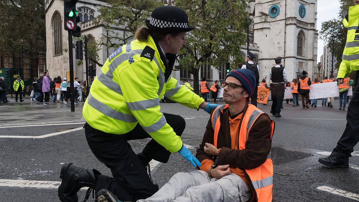 alert-–-is-this-just-stop-oil’s-latest-tactic?-eco-zealots-play-dead-as-officers-are-forced-to-drag-their-slumped-over-bodies-into-the-back-of-police-vans-during-slow-march-in-central-london-–-with-62-arrests-in-total