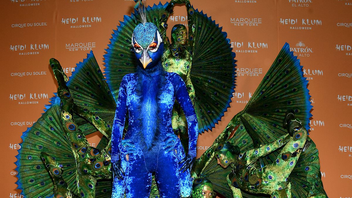 alert-–-heidi-klum-spreads-her-wings!-queen-of-halloween-dresses-up-as-a-peacock-with-10-person-entourage-while-her-husband-rolls-up-as-an-egg…-and-daughter-leni-almost-upstages-them-all-in-very-racy-outfit