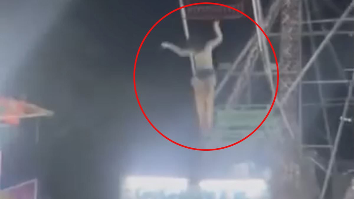 alert-–-fairground-horror-as-girl,-11,-is-left-hanging-from-ferris-wheel-when-seat-flips-up,-before-finally-losing-her-grip-in-front-of-screaming-crowd-and-smashing-through-stall