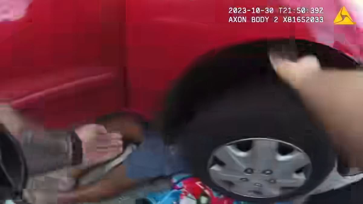 alert-–-dramatic-moment-florida-police-save-man-being-trapped-to-death-under-his-car-after-jack-collapsed-while-he-was-working-on-it