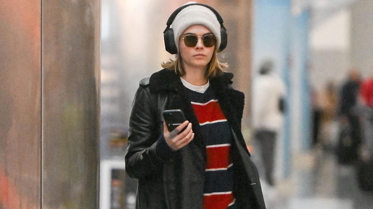 alert-–-cara-delevingne-nails-casual-chic-in-leather-coat-and-sunglasses -as-she-strolls-through-nyc-airport…-after-making-a-splash-on-ahs