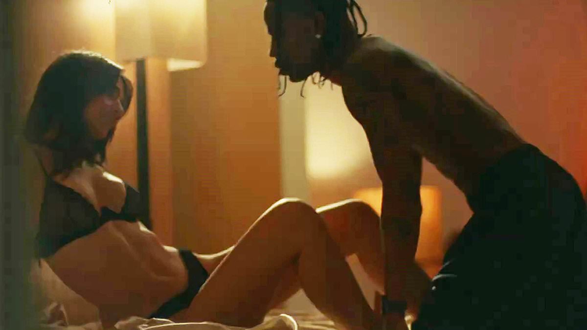 alert-–-emily-ratajkowski-puts-on-a-racy-display-in-black-lingerie-as-she-appears-as-travis-scott’s-romantic-interest-in-steamy-new-love-triangle-music-video