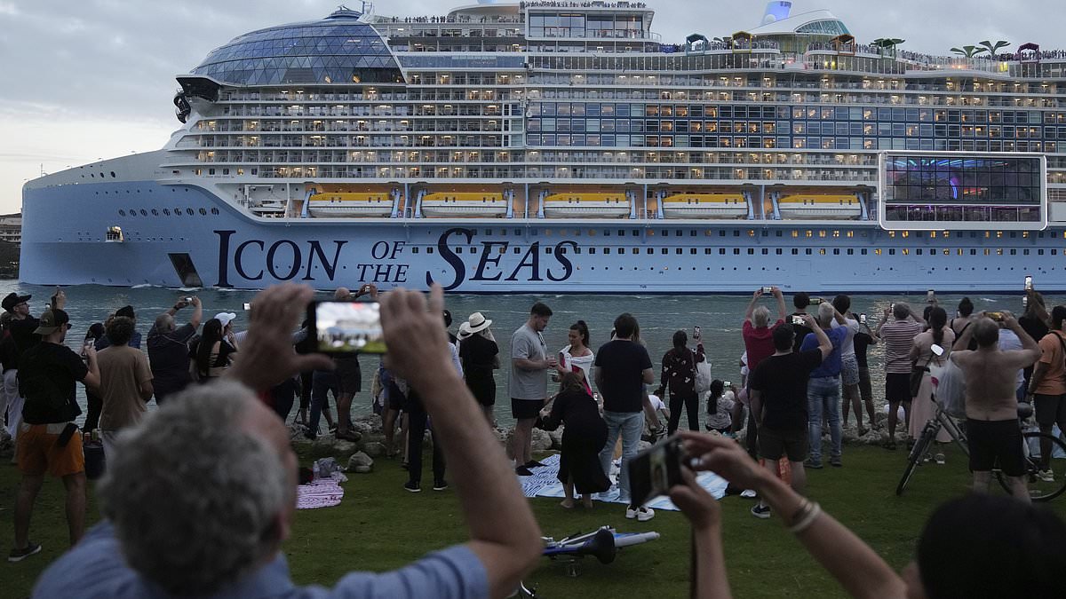 alert-–-world’s-largest-cruise-ship-icon-of-the-seas-sets-sail-on-its-maiden-voyage-from-miami-–-as-nearly-8,000-passengers-prepare-to-enjoy-55ft-waterfall,-40-restaurants-and-seven-swimming-pools