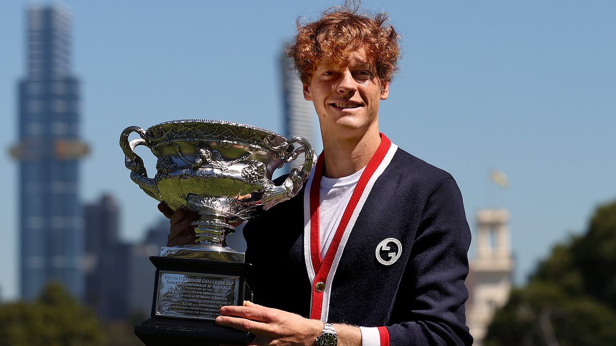 alert-–-jannik-sinner-poses-with-his-australian-open-trophy-after-history-making-win-–-and-you’ll-never-believe-how-much-his-cardigan-costs