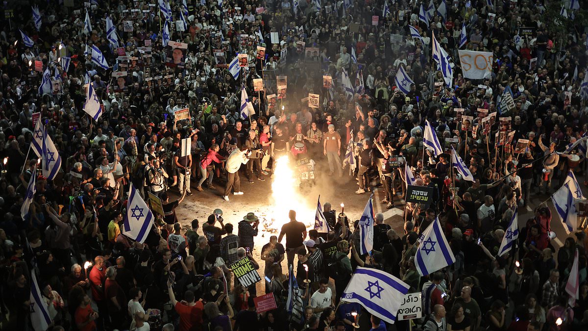 alert-–-demonstrators-in-tel-aviv-standing-against-benjamin-netanyahu’s-government-and-calling-for-the-release-of-hostages-kidnapped-in-the-deadly-october-7-light-fires-and-gag-themselves-in-protest
