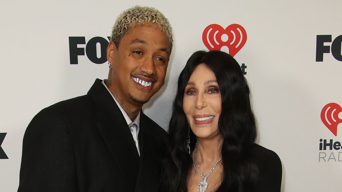 alert-–-cher,-77,-gets-a-kiss-from-boyfriend-alexander-edwards,-38,-as-he-supports-her-at-2024-iheartradio-music-awards