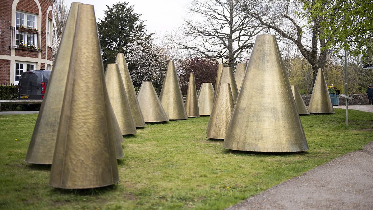 alert-–-controversial-19,500-publicly-funded-golden-cone-art-installation-once-likened-to-‘madonna’s-bra’-takes-dark-turn-after-entire-exhibit-turns-black-from-the-bad-weather