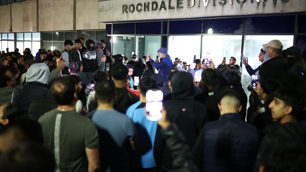 alert-–-crowd-of-hundreds-mass-overnight-outside-police-station-where-men-from-manchester-airport-video-were-taken-after-chaotic-incident-where-cop-kicked-and-stamped-on-man’s-head-chanting-‘gmp-shame-on-you’