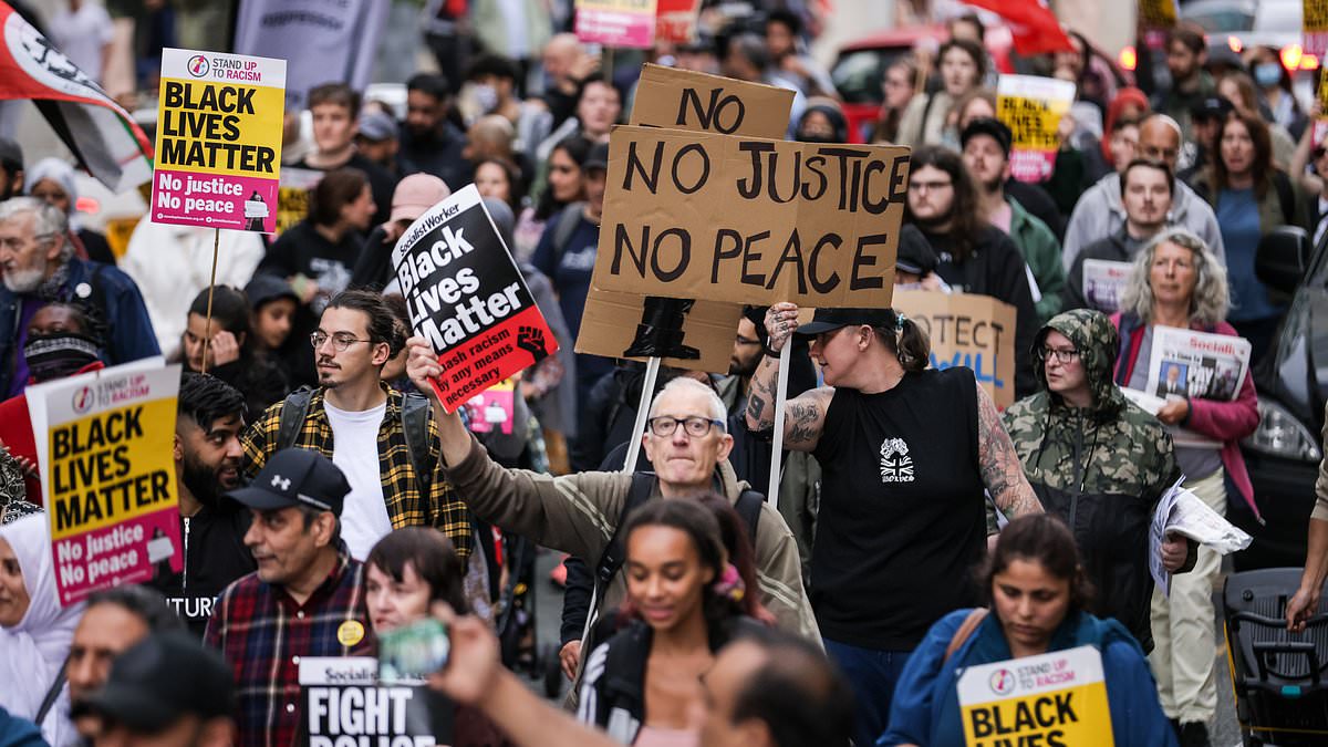 alert-–-crowds-of-protesters-block-roads-and-trams-in-manchester-city-centre-branding-police-‘racist’-and-calling-for-cops-to-be-sacked-over-airport-‘kicking-and-stamping’-attack-–-as-watchdog-opens-second-probe-and-sets-up-witness-hotline