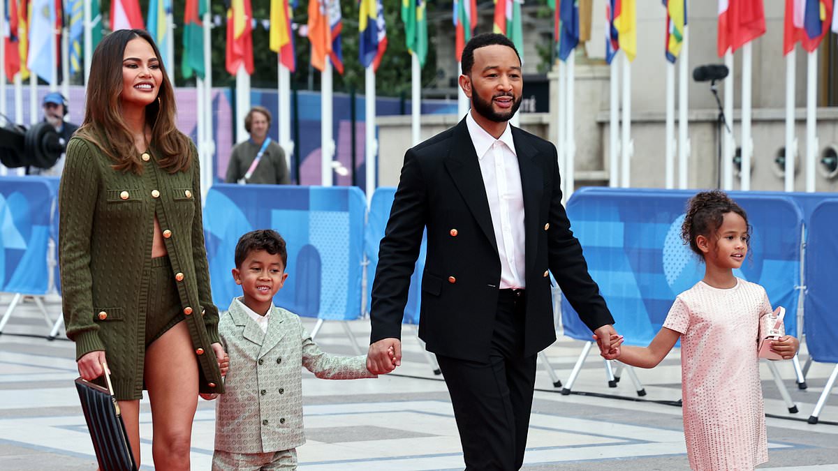 alert-–-leggy-chrissy-teigen-joins-fellow-a-listers-ariana-grande-and-lady-gaga-as-they-brave-the-prospect-of-rain-at-the-star-studded-opening-ceremony-of-the-olympics-in-paris