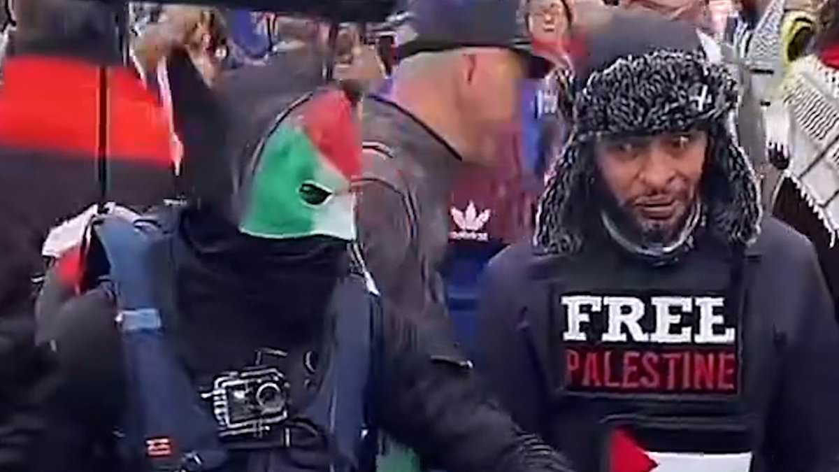 alert-–-moment-a-masked-protestor-‘dressed-as-a-hamas-terrorist’-wearing-a-pilots’-hat-and-makeshift-jet-pack-storms-through-the-streets-of-birmingham