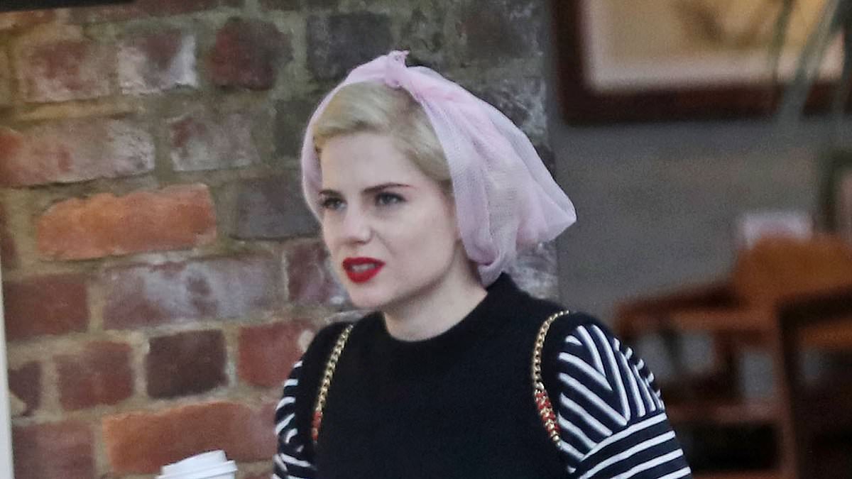 alert-–-lucy-boynton-cuts-a-casual-figure-in-black-top-and-pink-hairnet-as-she-grabs-a-coffee-while-on-break-from-filming-itv-drama-ruth