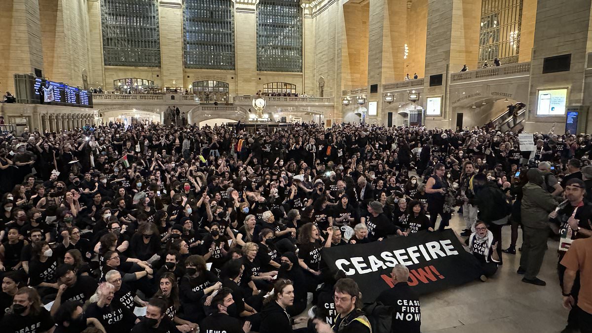 alert-–-pro-palestine-and-jewish-protestors-are-arrested-in-nyc-after-hundreds-stormed-grand-central-to-demand-a-ceasefire-–-as-israel-pummels-gaza-with-‘unprecedented’-airstrikes,-steps-up-ground-operations-and-‘cuts-all-communications’