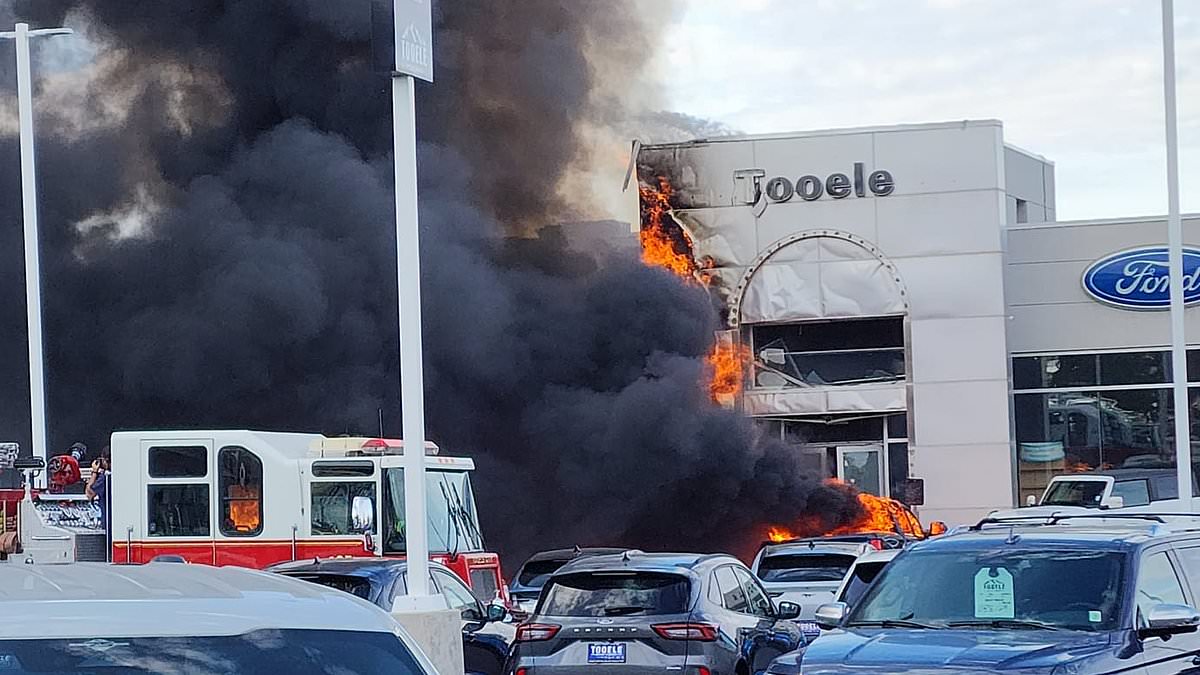 alert-–-multiple-cars-set-on-fire-after-out-of-control-semi-truck-crashes-into-the-side-of-a-utah-ford-dealership-causing-a-massive-explosion