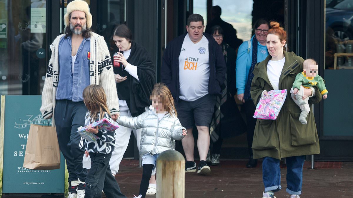 alert-–-comedian-russell-brand-is-spotted-with-his-growing-family-for-the-first-time-since-rape-accusations-made-against-him:-star,-48,-sported-1,400-cardigan-on-visit-to-upmarket-tebay-services-with-wife-laura,-two-daughters-and-newborn-son