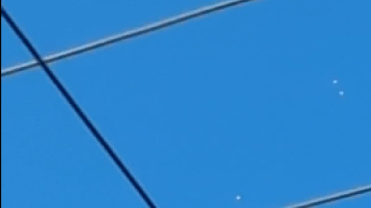 alert-–-bizarre-footage-shows-several-ufos-hovering-above-philadelphia-in-a-cluster-as-two-craft-are-seen-‘merging-together’-–-days-after-miami-’10ft-alien’-sighting-incident-forced-police-to-respond-to-conspiracy-claims