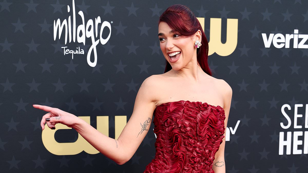 alert-–-dua-lipa-oozes-elegance-in-a-jaw-dropping-red-strapless-gown-as-she-arrives-at-the-star-studded-critics-choice-awards-in-santa-monica