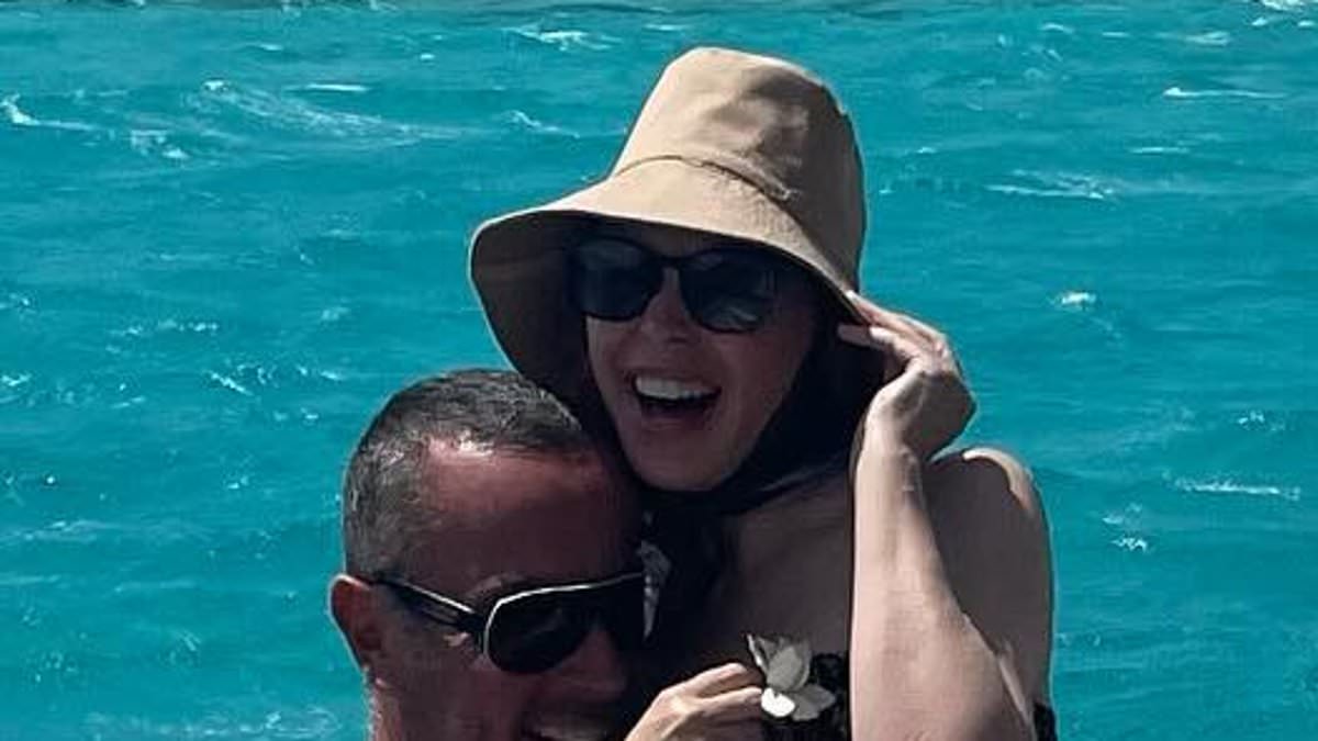 alert-–-kylie-minogue-kicks-her-toned-legs-into-the-air-as-her-male-pal-playfully-picks-her-up-in-fun-filled-ocean-snaps