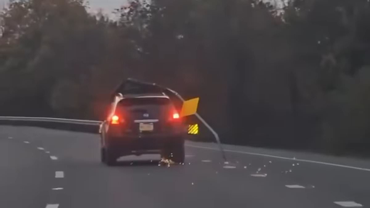 alert-–-car-spotted-driving-down-pennsylvania-highway-with-entire-road-sign-lodged-onto-the-roof