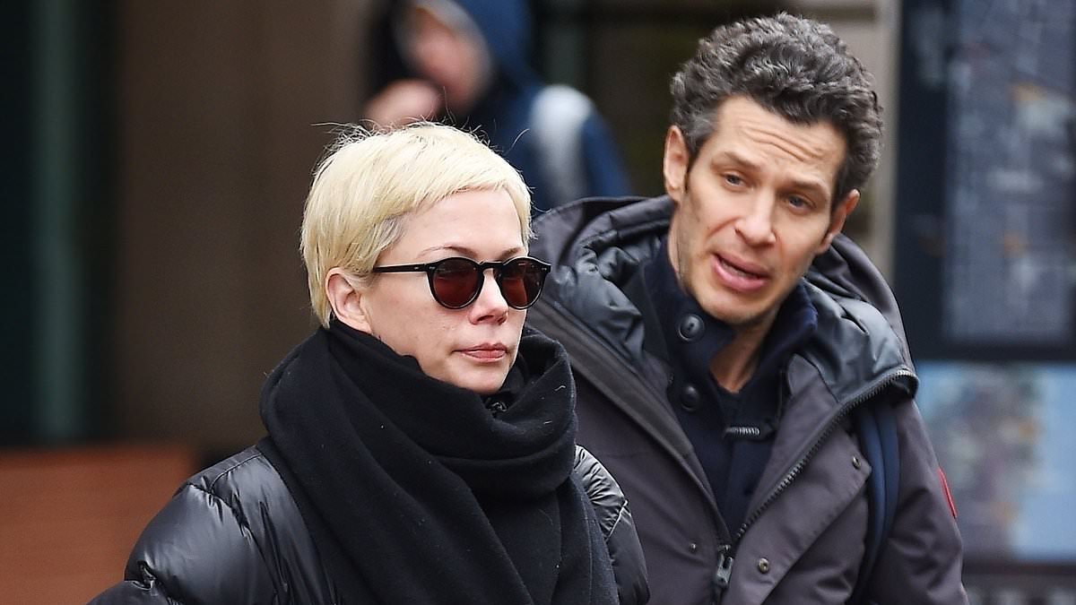 alert-–-michelle-williams-bundles-up-in-a-black-puffer-jacket-and-scarf-as-she-and-husband thomas-kail-step-out-in new-york