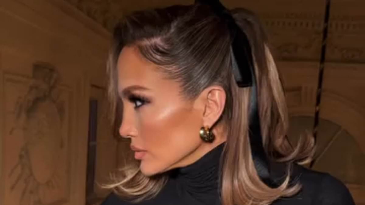 alert-–-jennifer-lopez-jumps-on-the-viral-coquette-trend-as-she-adorns-her-honey-blonde-locks-with-a-black-bow