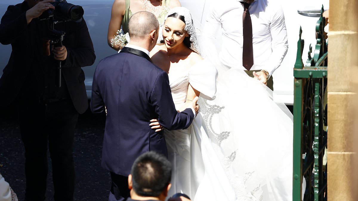 alert-–-proud-father-larry-emdur-shares-touching-moment-with-daughter-tia-as-he-walks-her-down-the-aisle-at-stunning-sydney-church-wedding-with-fiance rowell-jauco