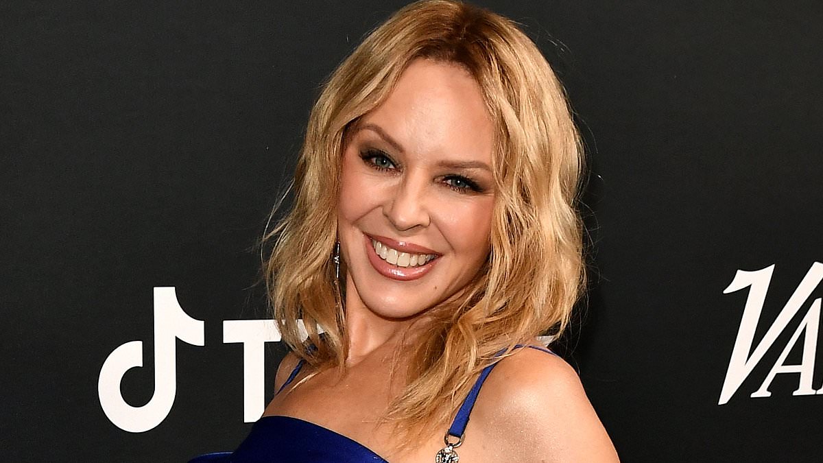 alert-–-kylie-minogue,-55,-exudes-youthful-radiance-in-electrifying-blue-as-she-joins-victoria-monet-and-andra-day-at-variety’s-grammy-cover-party