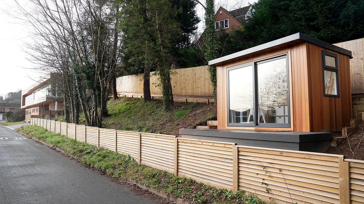 alert-–-is-this-britain’s-strangest-shed?-owner-of-‘brutal’-newbuild-mansion-mocked-for-building-a-‘costa-drive-thru’-summerhouse-on-side-of-main-road-–-but-wait-until-you-see-the-view