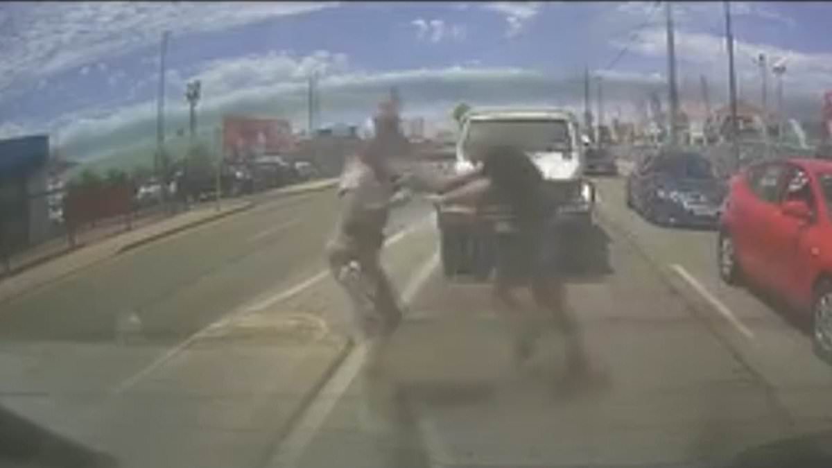 alert-–-wild-moment-driver-punches-motorist-through-his-car-window-before-fight-spills-onto-the-street-in-shocking-road-rage-attack