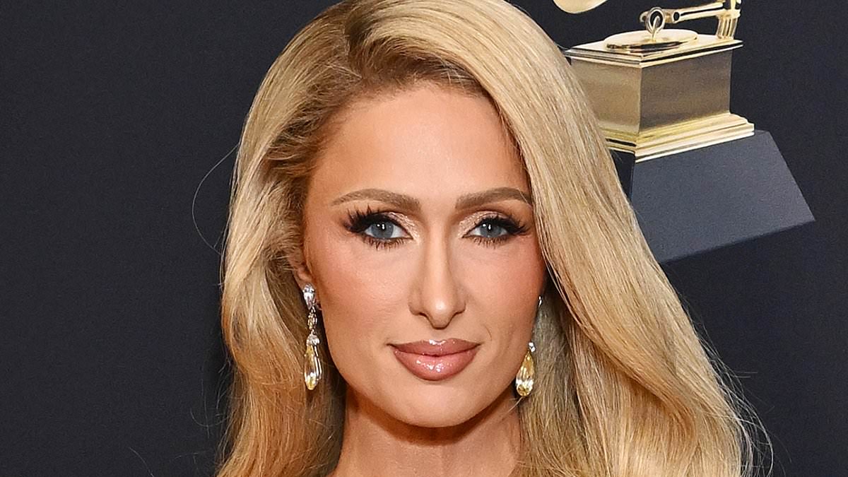 alert-–-paris-hilton-dazzles-in-a-glitzy-gold-dress-as-she-hits-the-red-carpet-with-husband-carter-reum-at clive-davis’-pre-grammy-gala