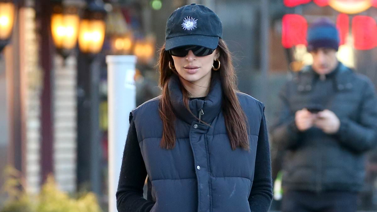 alert-–-emily-ratajkowski-wears-a-puffy-vest-over-a-t-shirt-with-khaki-slacks-during-a-walk-in-new-york-city…-after-sharing-bikini-photos