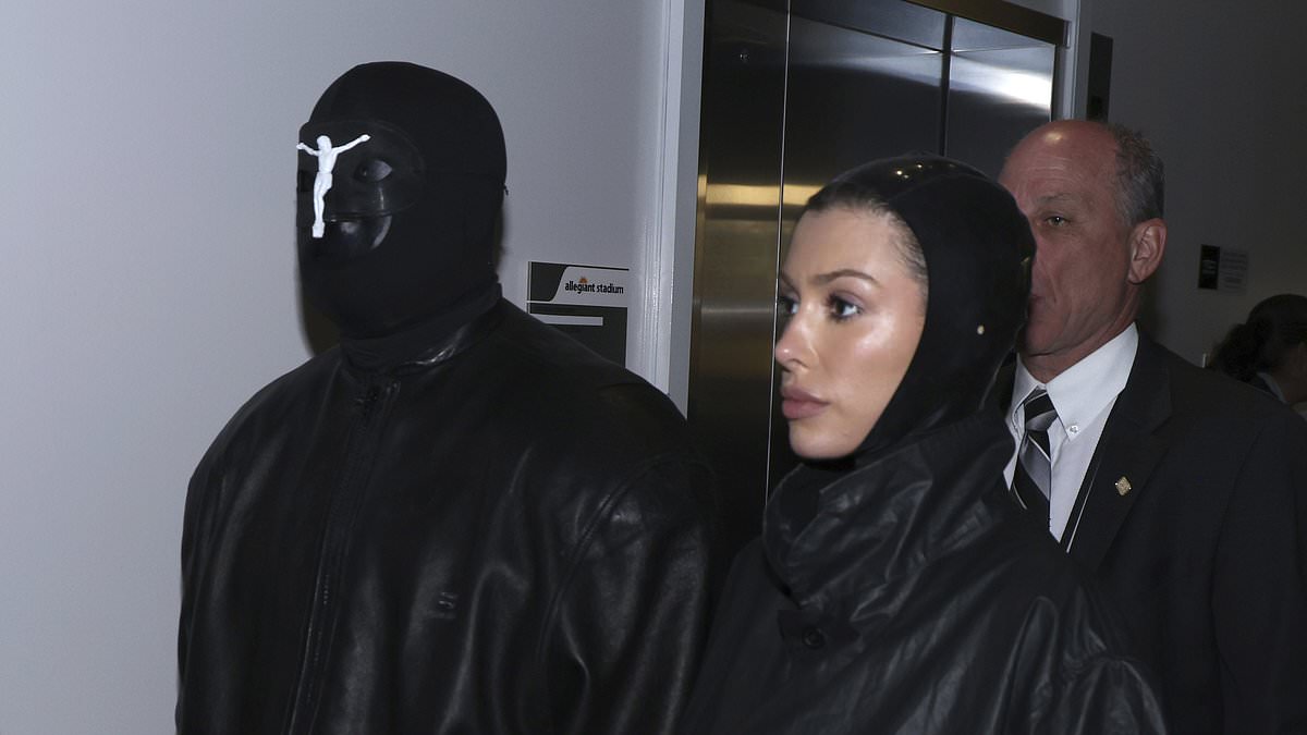 alert-–-kanye-west-steps-into-enemy-territory!-rapper-wears-mask-with-wife-bianca-censori-at-super-bowl-where-rival-taylor-swift-is-holding-court…-and-his-ex-wife-kim-kardashian-is-also-in-attendance-amid-hot-new-romance