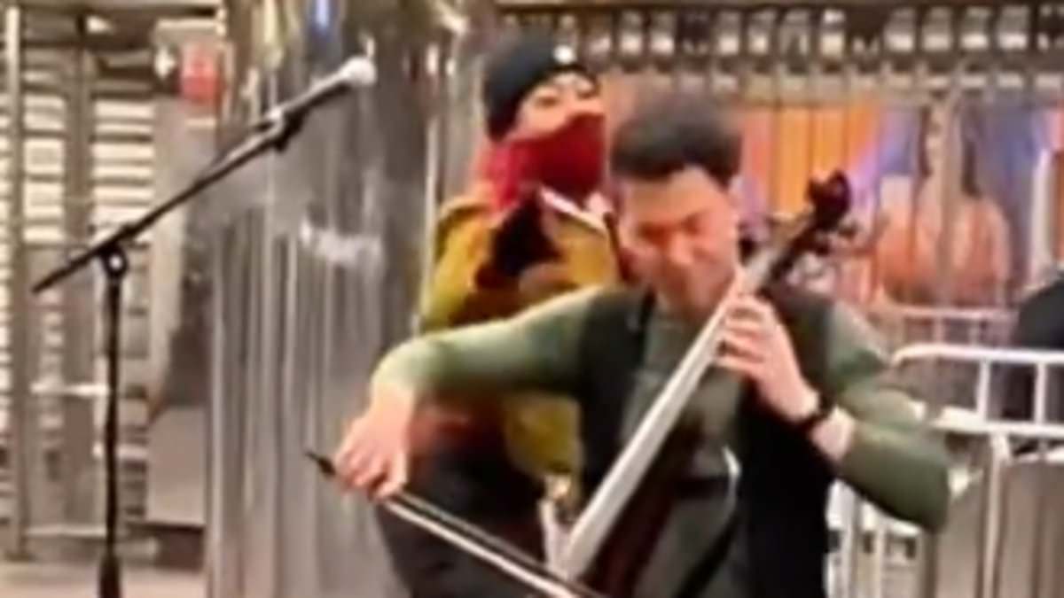 alert-–-shocking-moment-woman-attacks-a-cellist-playing-in-nyc-subway-station-by-hitting-him-over-the-head-with-a-metal-bottle-before-fleeing-and-evading-cops-inside-macy’s