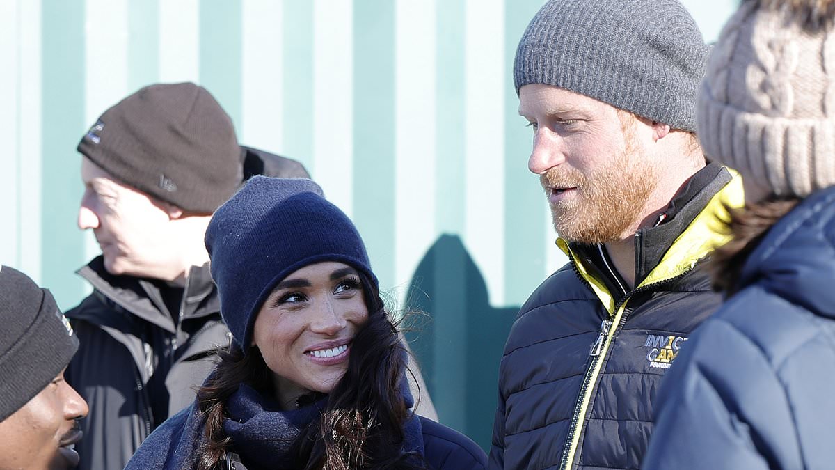 alert-–-doing-it-for-the-‘gram!-smiling-meghan-snaps-pictures-of-prince-harry-in-skeleton-bobsled-race-–-as-sussexes-hit-the-slopes-(with-a-tv-crew-in-tow)-just-hours-after-vowing-‘we-cannot-be-broken’-in-wake-of-rebrand-criticism