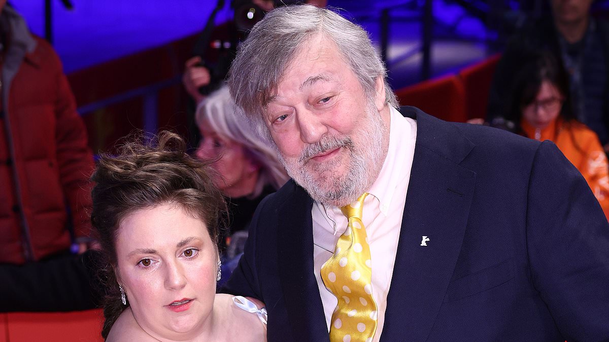 alert-–-lena-dunham-stuns-in-a-semi-sheer-ribbon-gown-as-she-cuddles-up-to-stephen-fry-at-another-end-premiere-during-the-berlin-film-festival