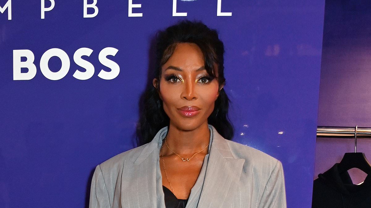 alert-–-naomi-campbell-teases-a-glimpse-of-her-cleavage-enhancing-bustier-beneath-a-chic-suit-as-she-promotes-new-boss-collection-at-selfridges