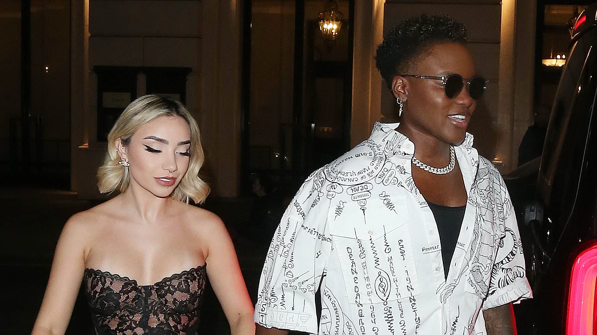 alert-–-nicola-adams-looks-smitten-as-she-holds-hands-with-girlfriend-ella-baig-at-the universal-baftas-party