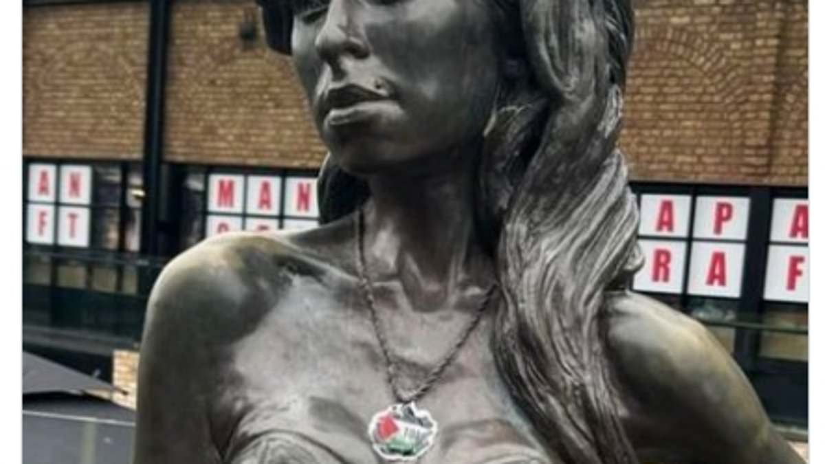 alert-–-fury-as-activists-deface-amy-winehouse-statue-in-camden-town-by-sticking-a-palestinian-flag-sticker-over-late-singer’s-star-of-david-necklace