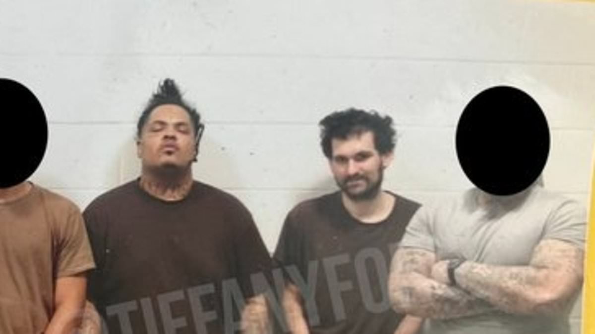 alert-–-the-crypto-g:-first-photo-of-sam-bankman-fried-in-jail-posing-with-gangsters-–-as-fellow-inmates-say-‘he’s-strange-as-sh*t’-but-‘a-good-guy’