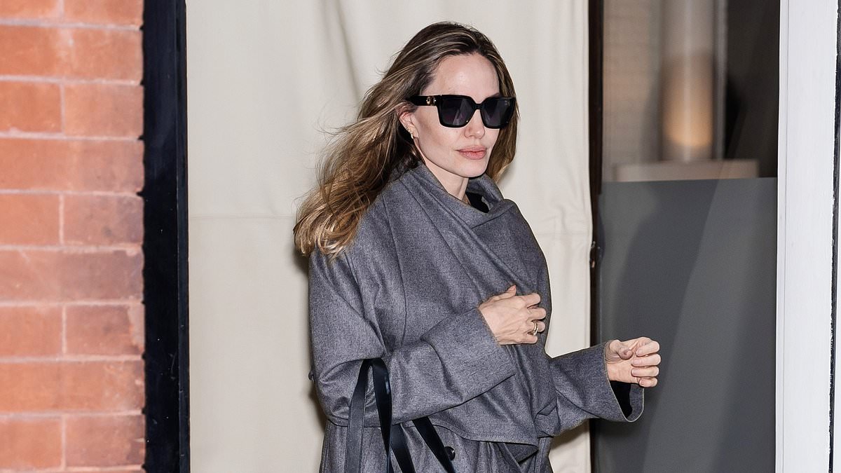 alert-–-angelina-jolie-shows-off-her-new-blondish-locks-as-she-models-chic-grey-trench-coat-and-quilted-bag-in-new-york-city