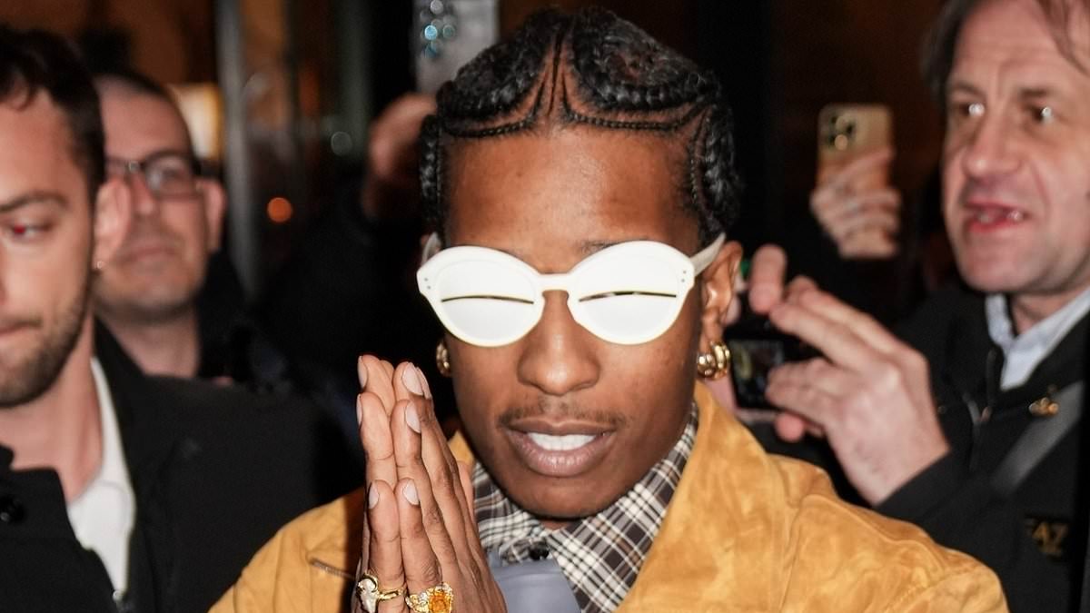 alert-–-a$ap-rocky-is-swarmed-by-fans-as-he-leaves-his-hotel-in-quirky-white-sunglasses-during-milan-fashion-week