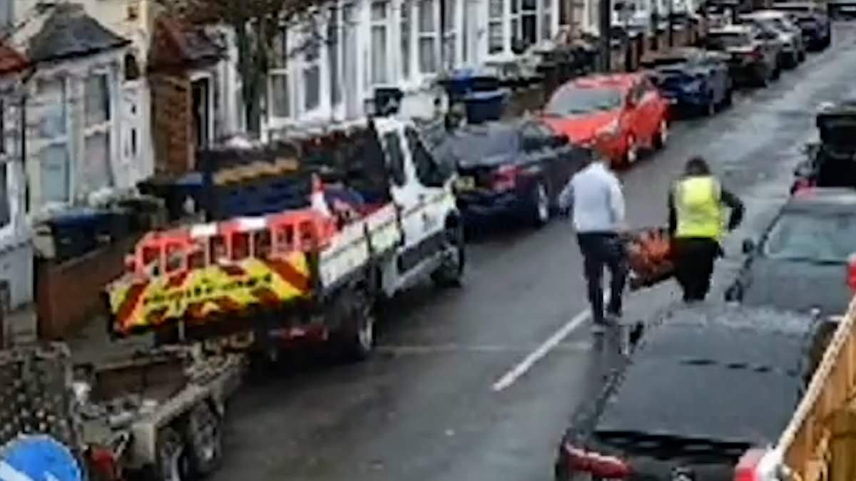 alert-–-moment-two-brazen-thieves-–-one-in-a-hi-vis-jacket-–-steal-machinery-from-a-truck-in-north-london-street-before-loading-it-into-the-back-of-a-car-and-driving-off