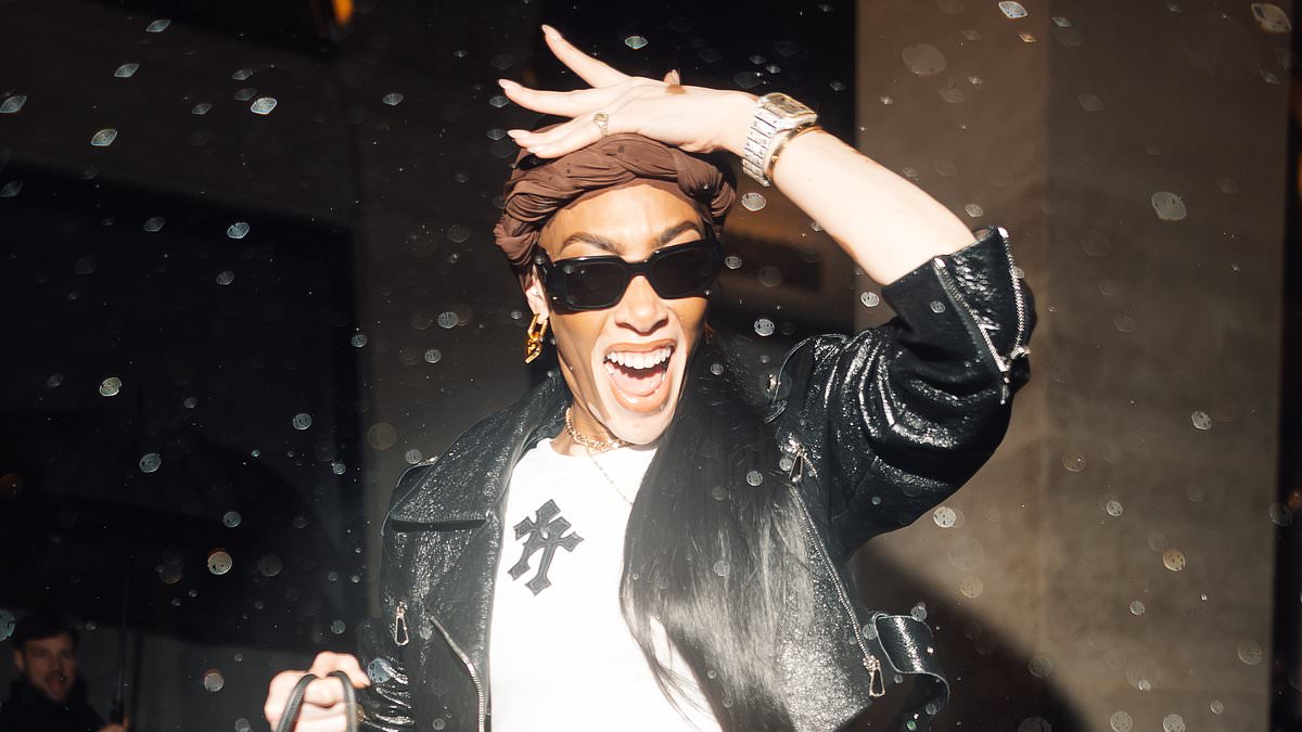 alert-–-winnie-harlow-brings-joie-de-vivre-to-paris-fashion-week-as-she-dashes-through-the-rain-to-stylish-party