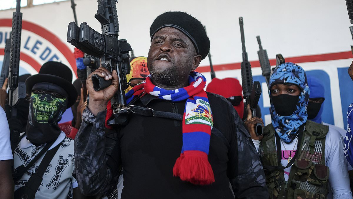 alert-–-the-feared-mob-boss-setting-lawless-haiti-ablaze:-how-ruthless-ex-cop-nicknamed-‘barbecue’-over-claims-he-burns-rivals-alive-has-triggered-chaos-by-trying-to-oust-country’s-pm-as-his-gang-breaks-4,000-criminals-out-of-jail