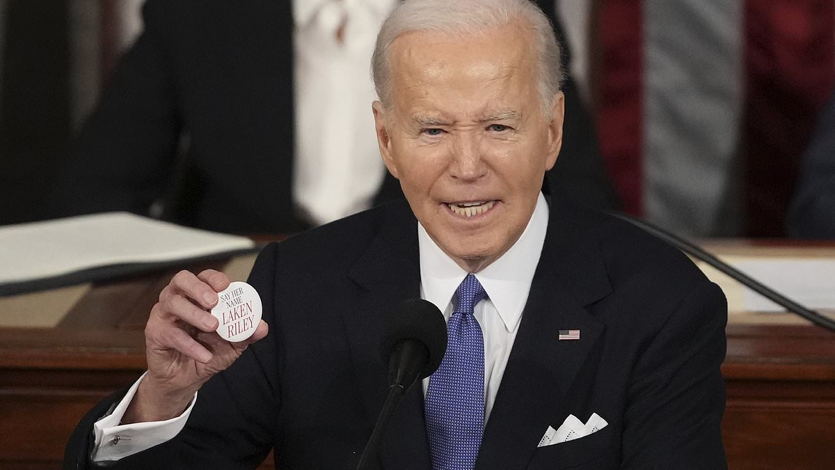 alert-–-biden-calls-murdered-jogger-‘lincoln-riley’:-president,-81,-holds-up-pin-given-by-marjorie-taylor-greene-and-says-georgia-student-was-‘killed-by-an-illegal’-but-gets-her-name-wrong