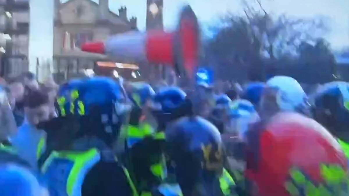 alert-–-shocking-moment-traffic-cone-is-thrown-at-police-as-football-fans-clash-with-officers-after-millwall’s-late-victory-over-birmingham-city