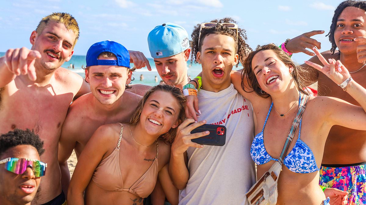 alert-–-what-crackdown?-florida-spring-breakers-fight-for-their-right-to-party-with-huge-brawl-erupting-on-the-beach-–-as-scantily-clad-revelers-smash-drinks-and-soak-up-the-sun-despite-tough-new-restrictions