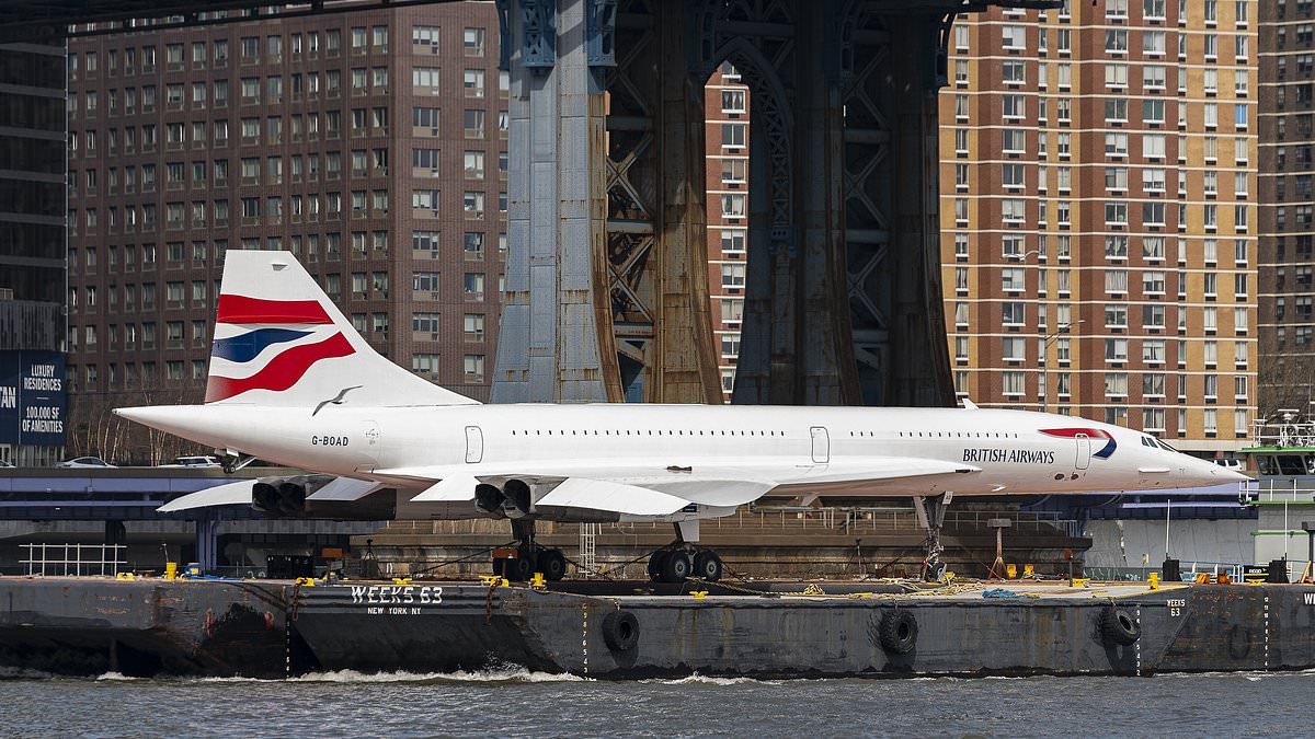 alert-–-concorde-is-floated-down-east-river-on-barge-after-months-long-refurbishment,-with-retired-former-british-airways-airliner-now-set-to-return-to-its-home-at-manhattan’s-intrepid-museum