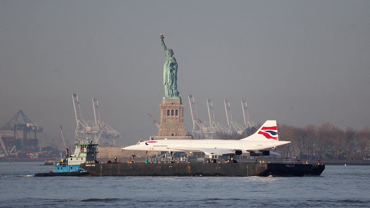 alert-–-lift-off!-british-airways-concorde-jet-is-craned-into-new-york-intrepid-museum-after-sailing-along-the-hudson